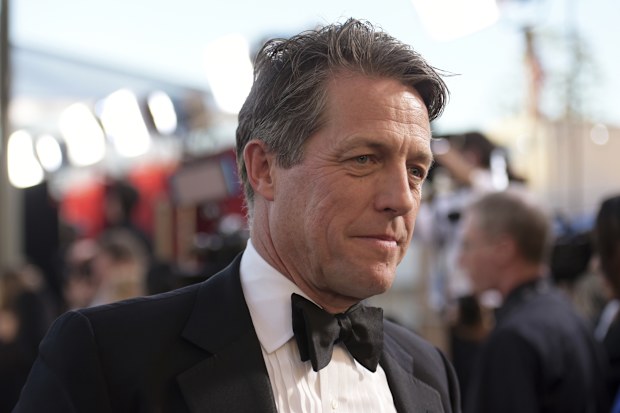 Hugh Grant arrives at the 23rd annual Screen Actors Guild Awards at the Shrine Auditorium & Expo Hall in Los Angeles, Sunday Jan. 29, 2023.
