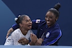 Jordan Chiles and Simone Biles celebrate as they see the scores and win bronze and silver medals in the floor routine on Aug. 5, 2024, at Bercy Arena during the Paris Olympics. (Brian Cassella/Chicago Tribune)