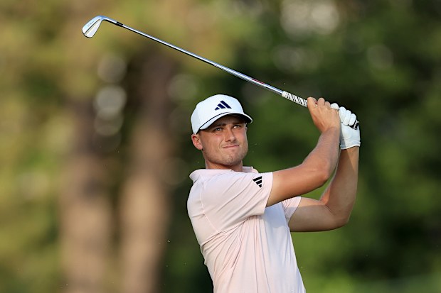 Ludvig Aberg of Sweden plays his second shot on the 18th hole.