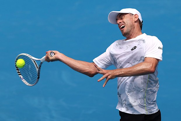 MELBOURNE, AUSTRALIA - JANUARY 10: John Millman of Australia plays a forehand during a training session ahead of the 2024 Australian Open at Melbourne Park on January 10, 2024 in Melbourne, Australia. (Photo by Kelly Defina/Getty Images)