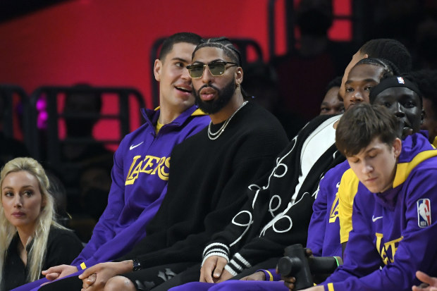 LOS ANGELES, CA - DECEMBER 23: Anthony Davis #3 of the Los Angeles Lakers looks on from the bench during the first half against Charlotte Hornets at Crypto.com Arena on December 23, 2022 in Los Angeles, California. NOTE TO USER: User expressly acknowledges and agrees that, by downloading and or using this photograph, User is consenting to the terms and conditions of the Getty Images License Agreement. (Photo by Kevork Djansezian/Getty Images)