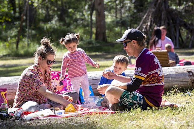 A family enjoys a picnic at Daisy Hill Forest Park in Brisbane, Saturday, May 2, 2020. 