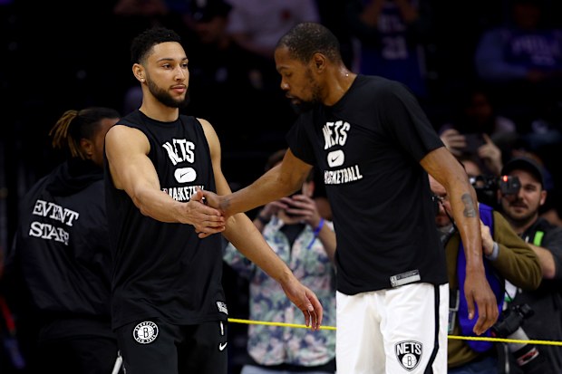 Ben Simmons and Kevin Durant of the Brooklyn Nets greet each other during warm ups before the game against the Philadelphia 76ers.