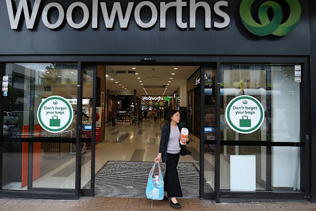 A customer exits a Woolworths Group Ltd. supermarket after purchasing paper towels in Sydney, Australia, on Wednesday, Mar. 4, 2020. Australia's four biggest lenders have heeded the prime ministers plea to "do their bit" to help the country weather the expected economic hit from the coronavirus, by passing on the central banks latest interest-rate cut in full. Photographer: Brendon Thorne/Bloomberg