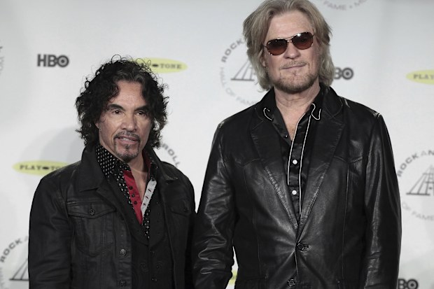 FILE - Hall of Fame Inductees, Hall & Oates, John Oates and Daryl Hall appear in the press room at the 2014 Rock and Roll Hall of Fame Induction Ceremony on April, 10, 2014, in New York.  Hall has sued his longtime music partner John Oates, arguing that his plan to sell off his share of a joint venture would violate a business agreement the duo had. (Photo by Andy Kropa/Invision/AP, File)