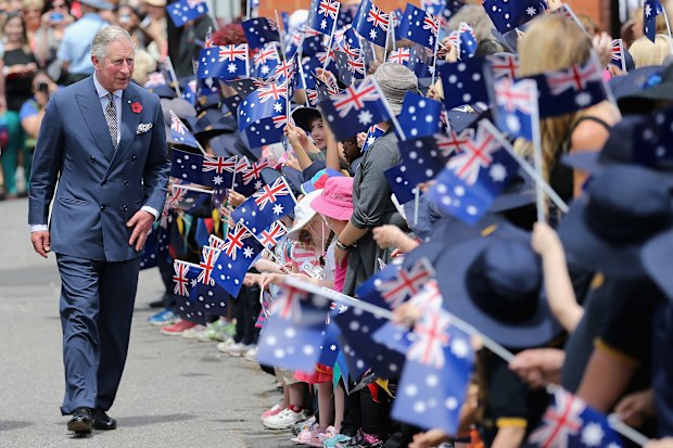 Schoolchildren wave Australian flags as Prince Charles, Prince of Wales visits Kilkenny Primary School on November 7, 2012 in Adelaide, Australia. The Royal couple are in Australia on the second leg of a Diamond Jubilee Tour taking in Papua New Guinea, Australia and New Zealand.