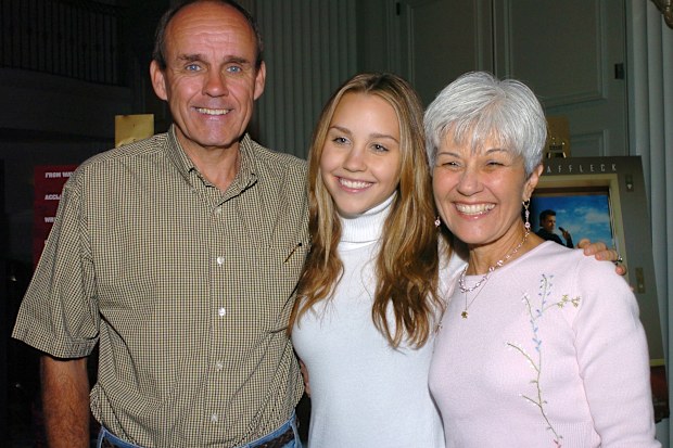 Amanda Bynes (center) with parents Rick and Lynn Bynes at the American Film Market media breakfast 4 November 2004 