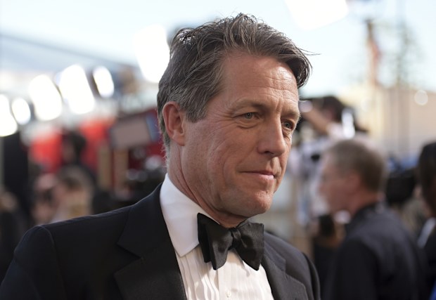 Hugh Grant arrives at the 23rd annual Screen Actors Guild Awards at the Shrine Auditorium & Expo Hall in Los Angeles, Sunday Jan. 29, 2023.