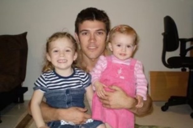 Kevin Douglas with his daughters Mia (left) and Chloe (right).