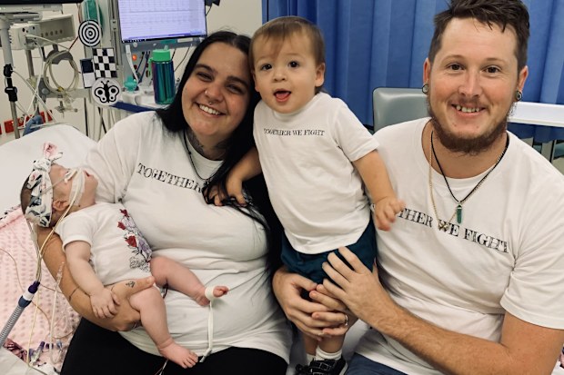 Latoya and Cameron with their children, Luna and Forrest in hospital.