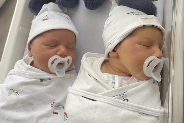 Identical twins Gillianne Gogas and Nicole Patrikakos were born together - and now the sisters have given birth together in mind-bogging synchronicity.