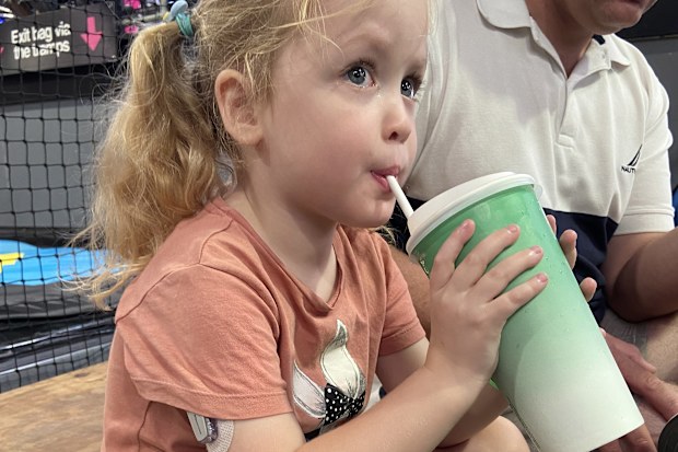 Hailey with a continuous glucose monitor on her arm.