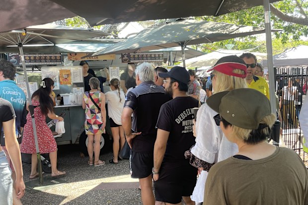 People lining up at a food truck at Parap Market in Darwin