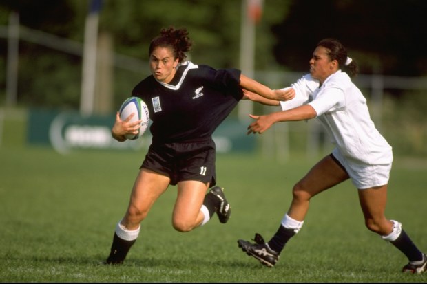 Louisa Wall of New Zealand fends off Paula George of England.