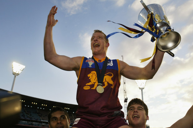 MELBOURNE, AUSTRALIA - SEPTEMBER 27:  Michael Voss #3 for Brisbane celebrates with the cup after the AFL Grand Final between the Collingwood Magpies and the Brisbane Lions at the Melbourne Cricket Ground September 27, 2003 in Melbourne, Australia. (Photo by Hamish Blair/Getty Images)