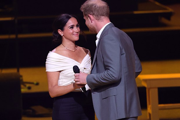 Prince Harry, Duke of Sussex and Meghan, Duchess of Sussex on stage during the Invictus Games The Hague 2020 Opening Ceremony at Zuiderpark on April 16, 2022 in The Hague, Netherlands. (Photo by Chris Jackson/Getty Images for the Invictus Games Foundation )