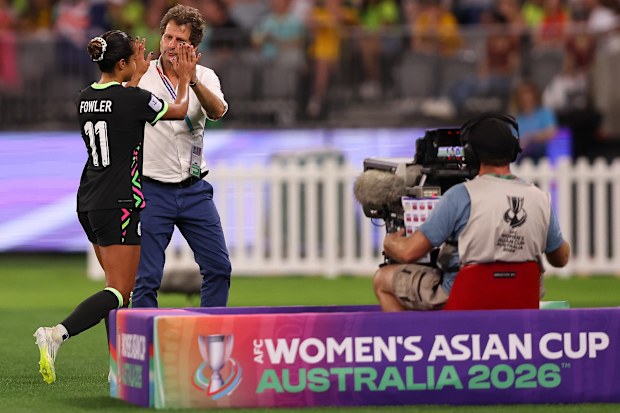 Joe Montemurro embraces Mary Fowler after the Matildas' win against China in the 2026 Asian Cup.