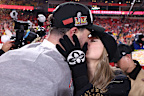 KANSAS CITY, MISSOURI - JANUARY 26: Taylor Swift kisses Travis Kelce #87 of the Kansas City Chiefs after defeating the Buffalo Bills 32-29 in the AFC Championship Game at GEHA Field at Arrowhead Stadium on January 26, 2025 in Kansas City, Missouri.  (Photo by Jamie Squire/Getty Images)