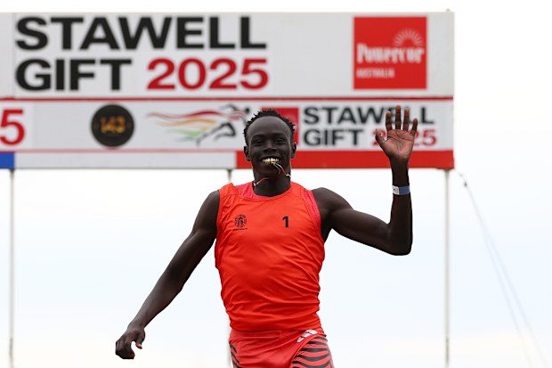 Gout Gout celebrates winning his heat of the men's 120 metres at the 2025 Stawell Gift.