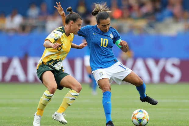Marta of Brazil is challenged by Chloe Logarzo of Australia (Photo by Elsa/Getty Images)