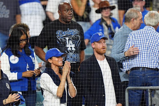 Prince Harry and Meghan Markle, the Duke and Duchess of Sussex, at Game 4 of baseball's World Series between the Los Angeles Dodgers and the Toronto Blue Jays in Los Angeles, Tuesday, Oct. 28, 2025. 