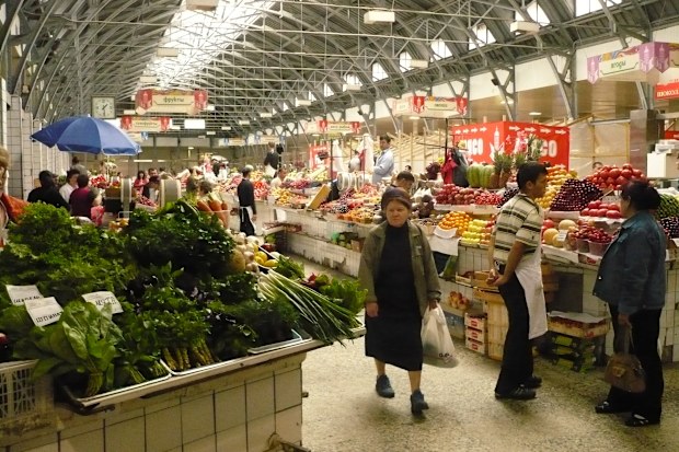 St. Petersburg, Russia, June 14, 2099 - The Kuznetschnyj Rynok market hall in St Petersburg with unidentified people in the background.