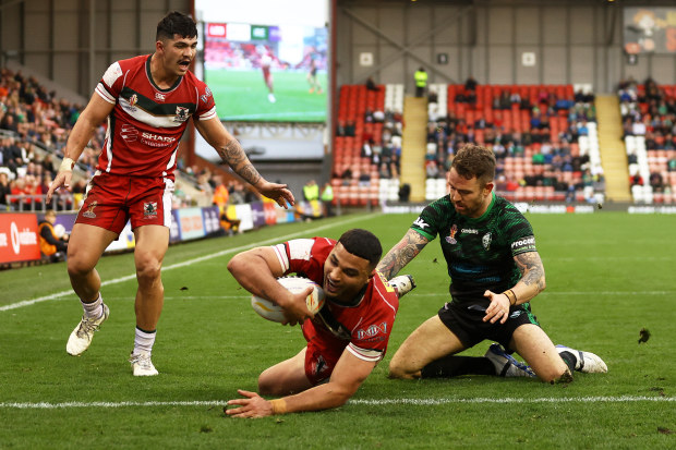 Ellie El-Zakham of Lebanon goes over to score their sides fourth try during the Rugby League World Cup 2021 Pool C match between Lebanon and Ireland at Leigh Sports Village on October 23, 2022 in Leigh, England. (Photo by Michael Steele/Getty Images)