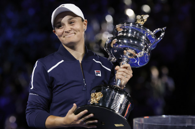 Ash Barty holds the Daphne Akhurst Memorial Cup after defeating Danielle Collins in the women's singles final at the Australian Open.
