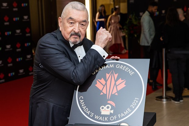TORONTO, ONTARIO - DECEMBER 03: Graham Greene attends the unveiling of his Canadas Walk of Fame 2021 commemorative plaque for Arts & Entertainment during the 2022 Canada's Walk of Fame Gala at Beanfield Centre, Exhibition Place on December 03, 2022 in Toronto, Ontario. (Photo by Mathew Tsang/Getty Images)