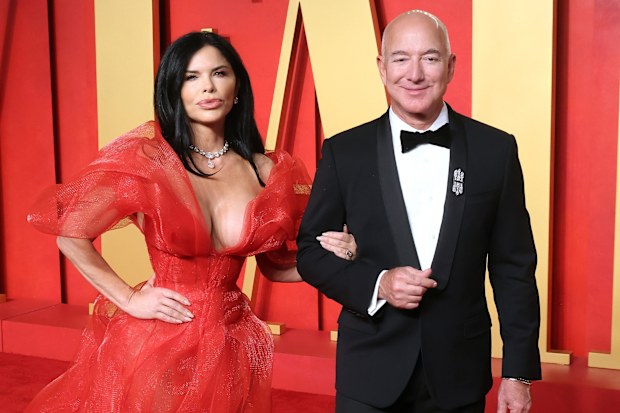 Lauren Sanchez and Jeff Bezos attend the 2024 Vanity Fair Oscar Party hosted by Radhika Jones at Wallis Annenberg Center for the Performing Arts on March 10, 2024 in Beverly Hills, California. 