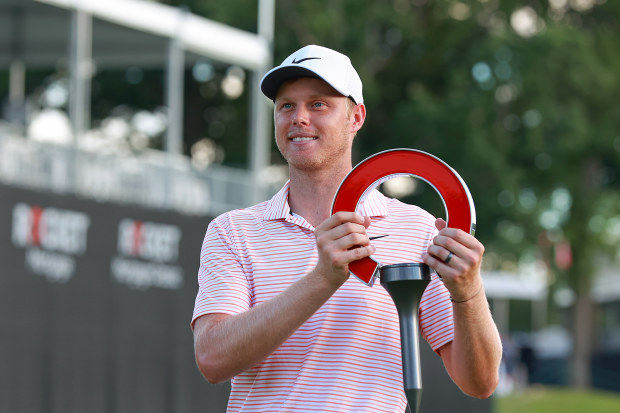 Cameron Davis of Australia holds the trophy during the awards ceremony after winning the Rocket Mortgage Classic for the second time at Detroit Golf Club on Sunday, June 30, 2024 in Detroit, Michigan. (Photo by Amy Lemus/NurPhoto)