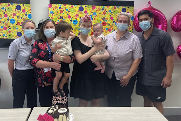 Melanie Thackeray with her partner and children and Mater Brisbane staff 