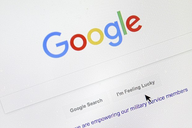 A cursor moves over Google's search engine page on Aug. 28, 2018, in Portland, Ore. 