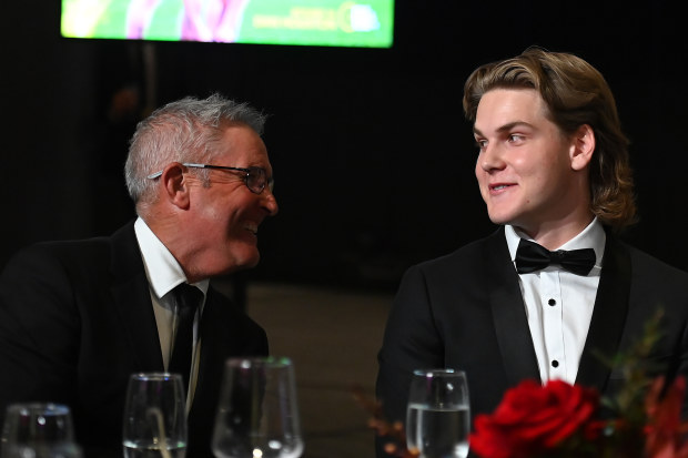 Chris Fagan laughs with Lions young gun Will Ashcroft during the Brownlow.
