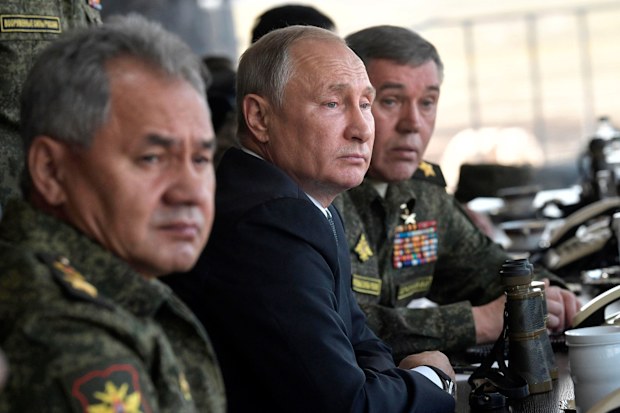 Russian President Vladimir Putin watches military exercises