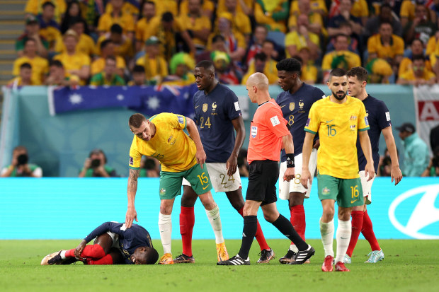 Ousmane Dembele of France lies on the pitch after a challenged by Mitchell Duke of Australia. (Photo by Elsa/Getty Images)