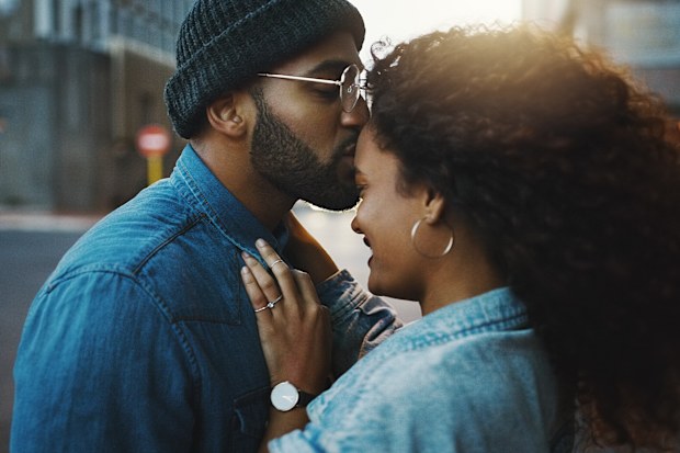 Shot of a young couple sharing a romantic moment in the city