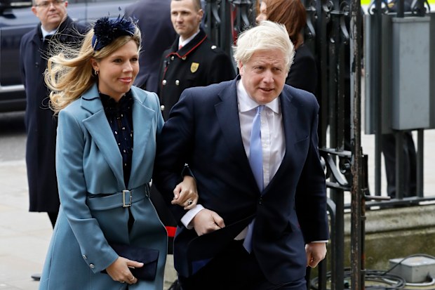 In this Monday, March 9, 2020, file photo Britain's Prime Minister Boris Johnson and his partner Carrie Symonds arrive to attend the annual Commonwealth Day service at Westminster Abbey in London.