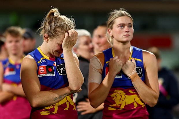 Isabel Dawes and Lily Postlethwaite of the Lions look dejected after losing the AFLW Grand Final.