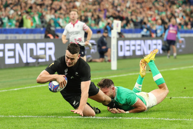 Will Jordan scores his team's third try during the Rugby World Cup match between Ireland and New Zealand at Stade de France.