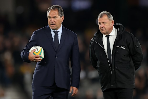 Wallabies coach Dave Rennie talks to All Blacks coach Ian Foster.