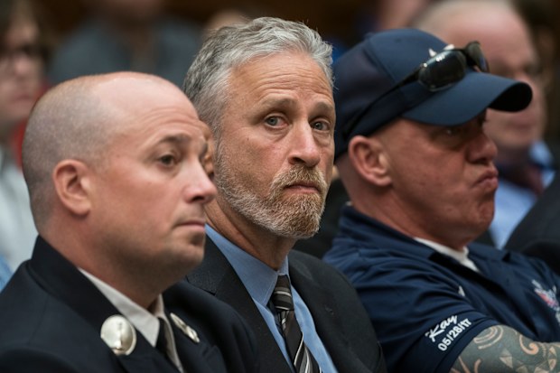 Entertainer and activist Jon Stewart, centre, lends his support to firefighters, first responders and survivors of the September 11 terror attacks at a hearing by the House Judiciary Committee on Capitol Hill in Washington.