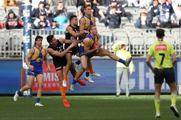 Oscar Allen marks the ball.