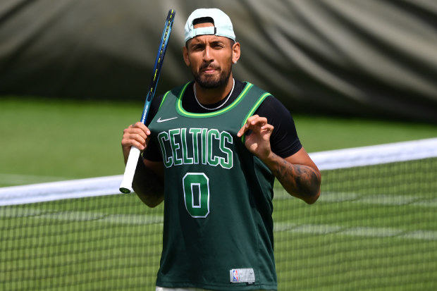Nick Kyrgios of Australia is seen practising in a Boston Celtics Basketball Jersey on day eleven of The Championships Wimbledon 2022 at All England Lawn Tennis and Croquet Club.
