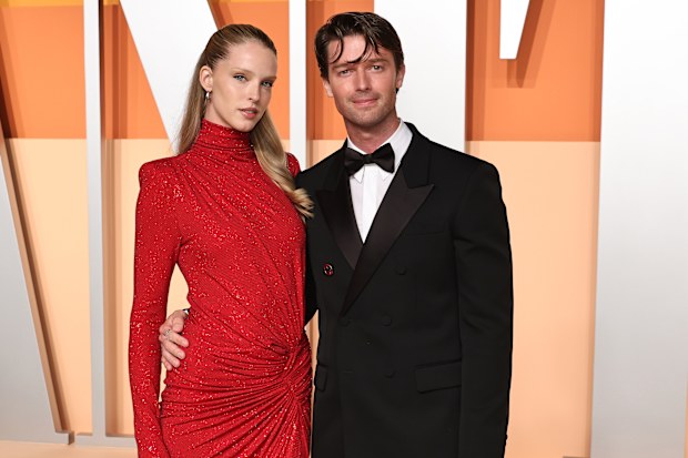 Abby Champion and Patrick Schwarzenegger at the 2025 Vanity Fair Oscar Party at Wallis Annenberg Center for the Performing Arts on March 2, 2025 in Beverly Hills, California. 