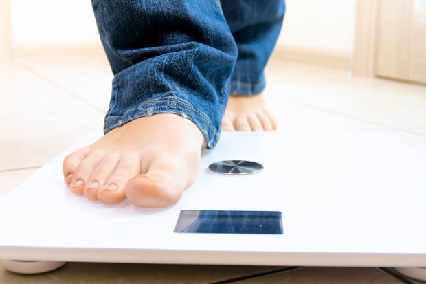 Person being weighed stock photo