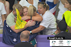 Jessica Hull embraces family after 1500m silver medal race.