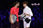 Winner Jannik Sinner of Italy and runner-up Alexander Zverev of Germany embrace at the Men's Singles trophy presentation following the Men's Singles final during day 15 of the 2025 Australian Open at Melbourne Park on January 26, 2025 in Melbourne, Australia. (Photo by Quinn Rooney/Getty Images)