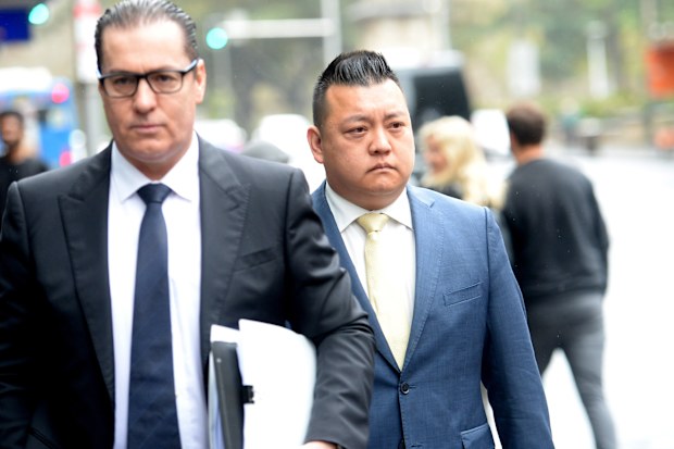 NSW Labor's community relations director Kenrick Cheah (right) arrives at the ICAC public inquiry into allegations concerning political donations, Sydney.