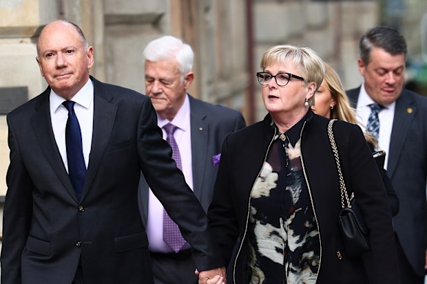 Former Minister Linda Reynolds arrives at the Supreme Court in Perth for the defamation trial, with husband Robert Reid 
